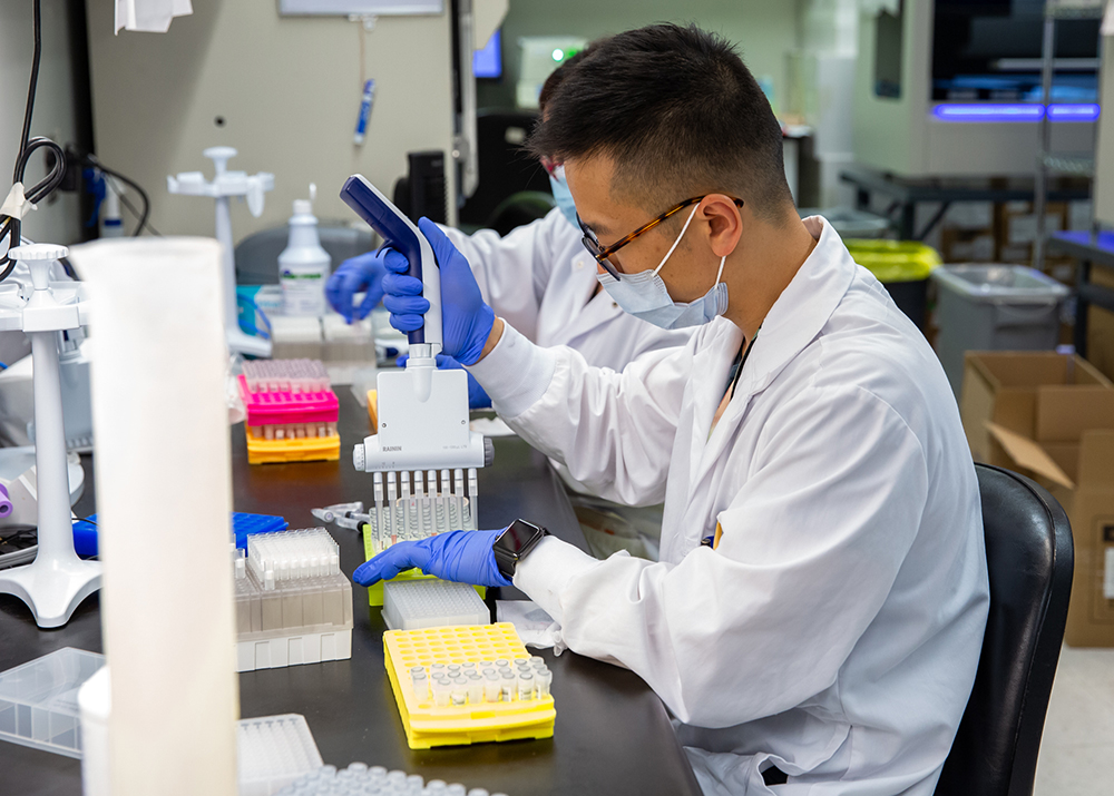 Lab performing testing in the microbiology department