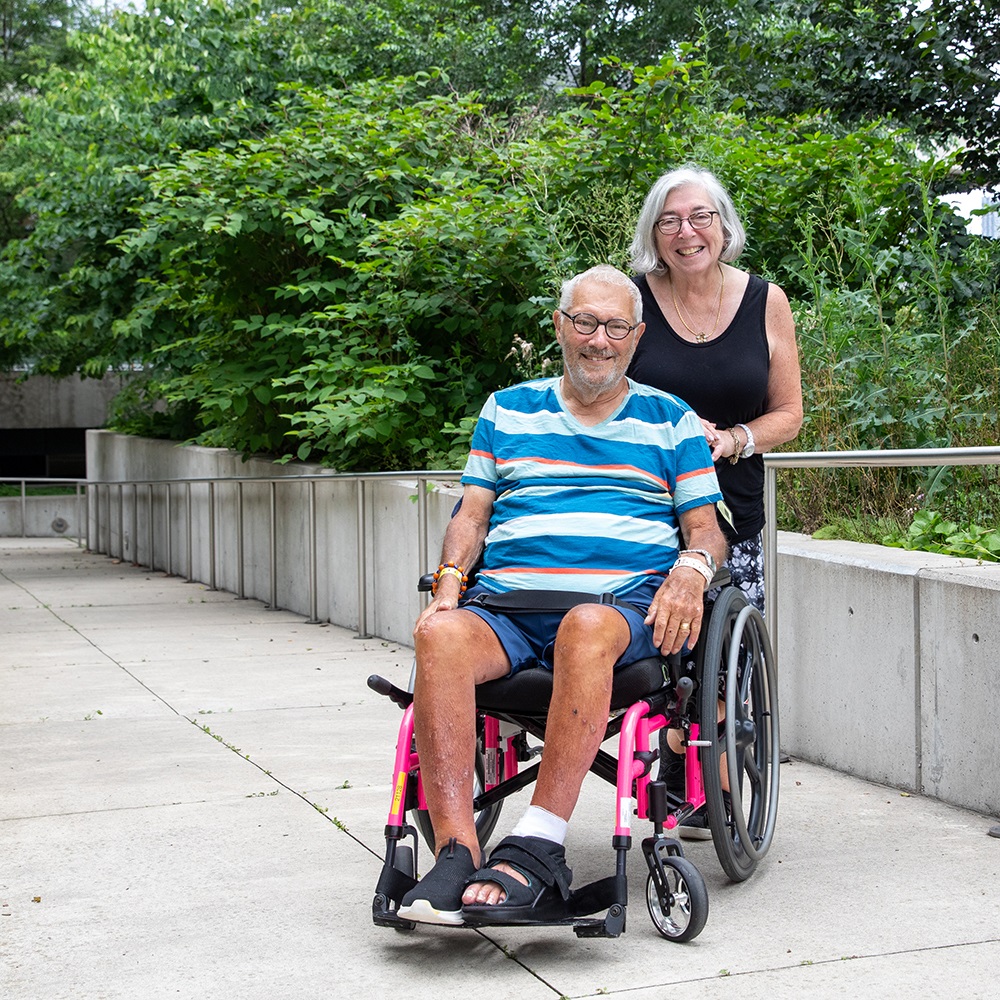 Neil, a patient at Hennick Bridgepoint, enjoys the outdoor spaces around the hospital with his wife Ellen