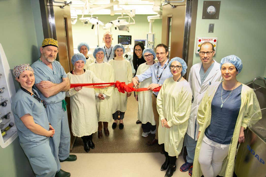 Clinicians standing in front of the newly opened operating room.