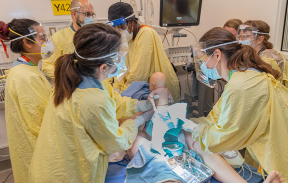 The mannequin infant is then resuscitated, and two separate teams continue to simulate the care of the pregnant mannequin and the infant.