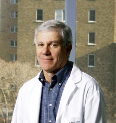 Headshot of Dr. Allan Detsky wearing white labcoat