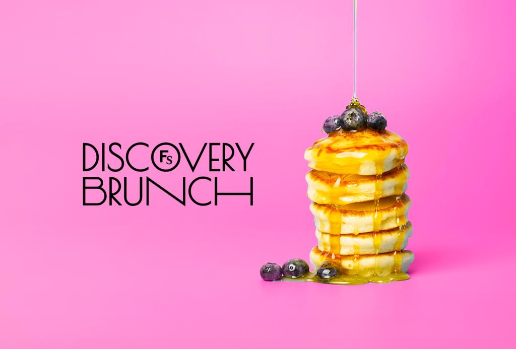 Logo that says discovery brunch next to a stack of pancakes on a bright pink background