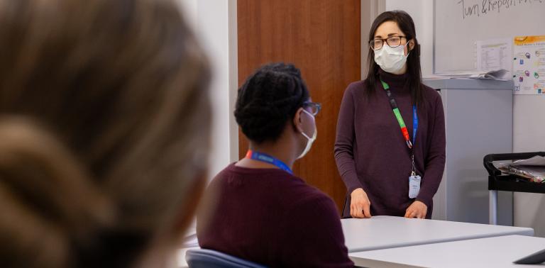 A nurse educator speaks to a classroom of Sinai Health employees