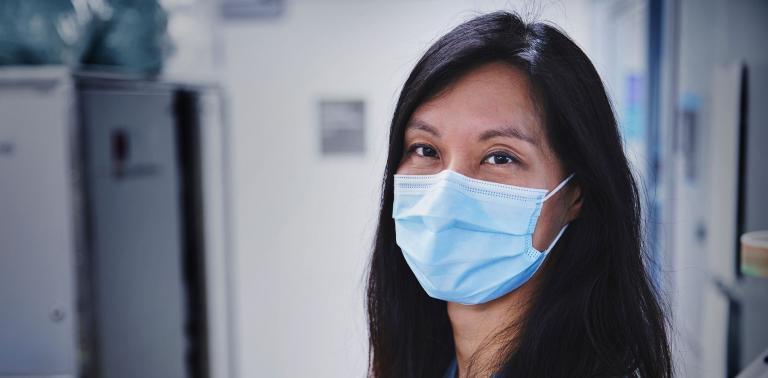 Doctor Christie Lee looking at the camera while wearing a mask