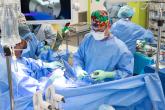 A surgery team performs a gynaecologic surgery in the operating room