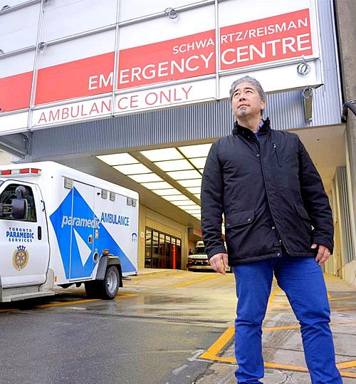 Dr. Jacques Lee standing in front of the emergency entrance