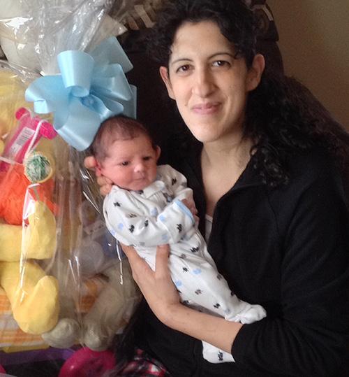 Andrea Querido holding her infant son, Anthony