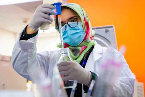 A woman using science equipment