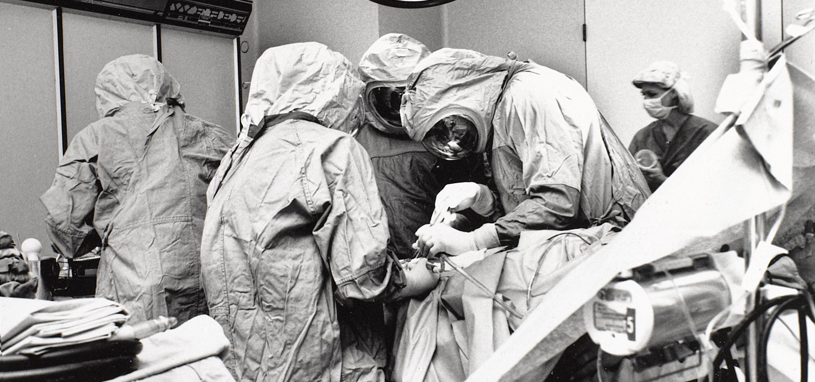 black and white photo of a surgical team operating on a patient