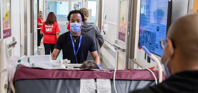 a patient being moved from an old ICU into the newly opened one