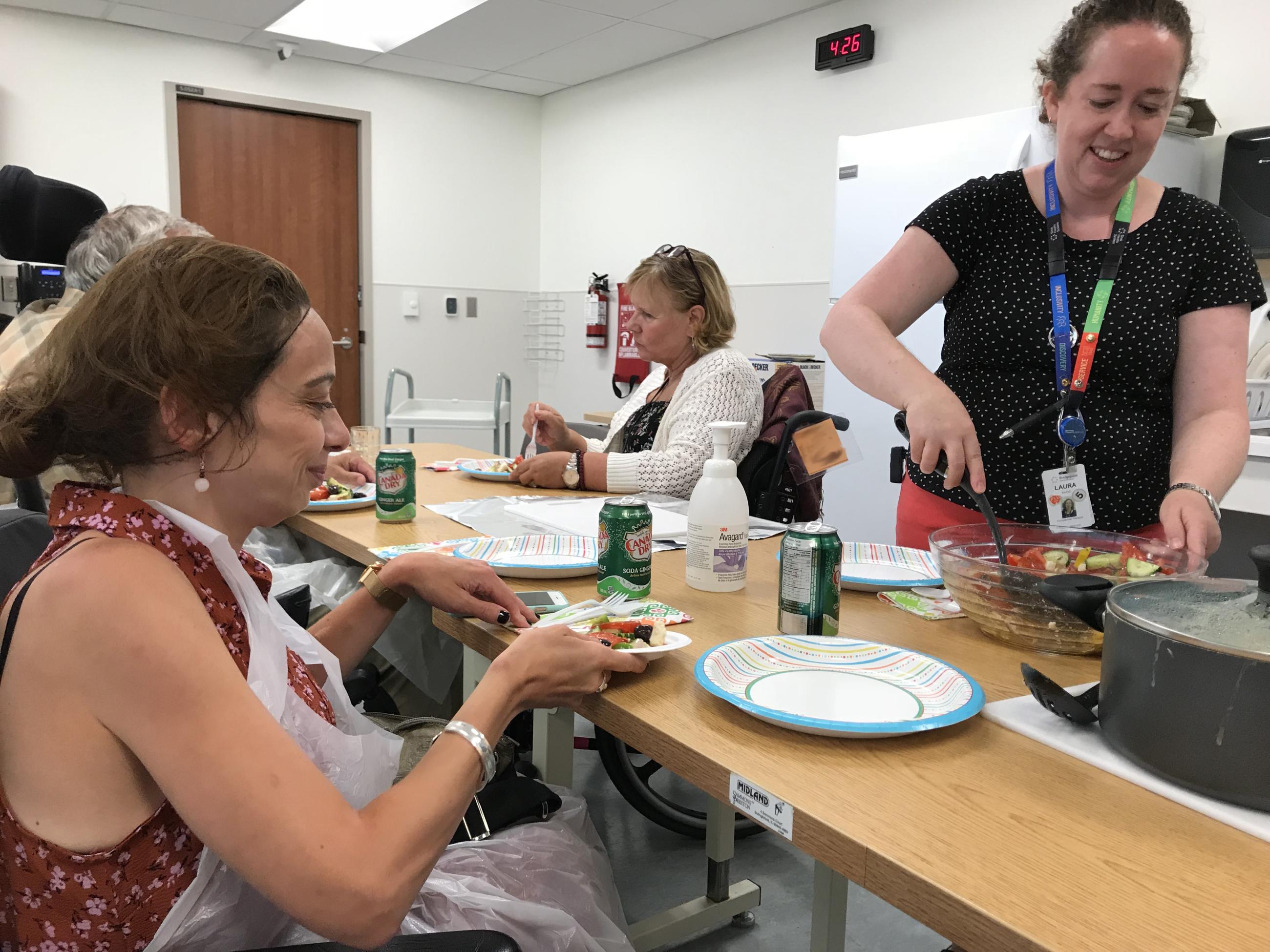 Hennick Bridgepoint patients enjoying Occupational Therapy, cooking a meal together