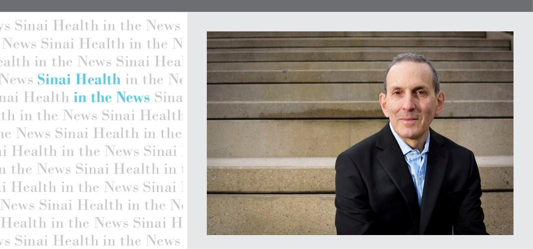 Man in suit sitting on steps with a graphic treatment on the left.