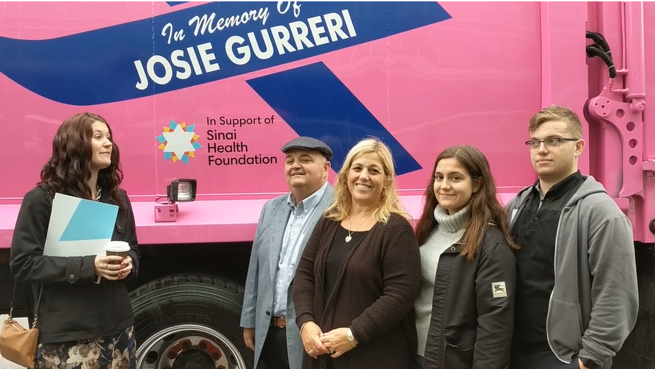 The Gurreri family in front of their pink truck.