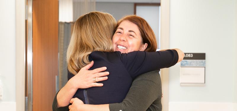 Two women hugging