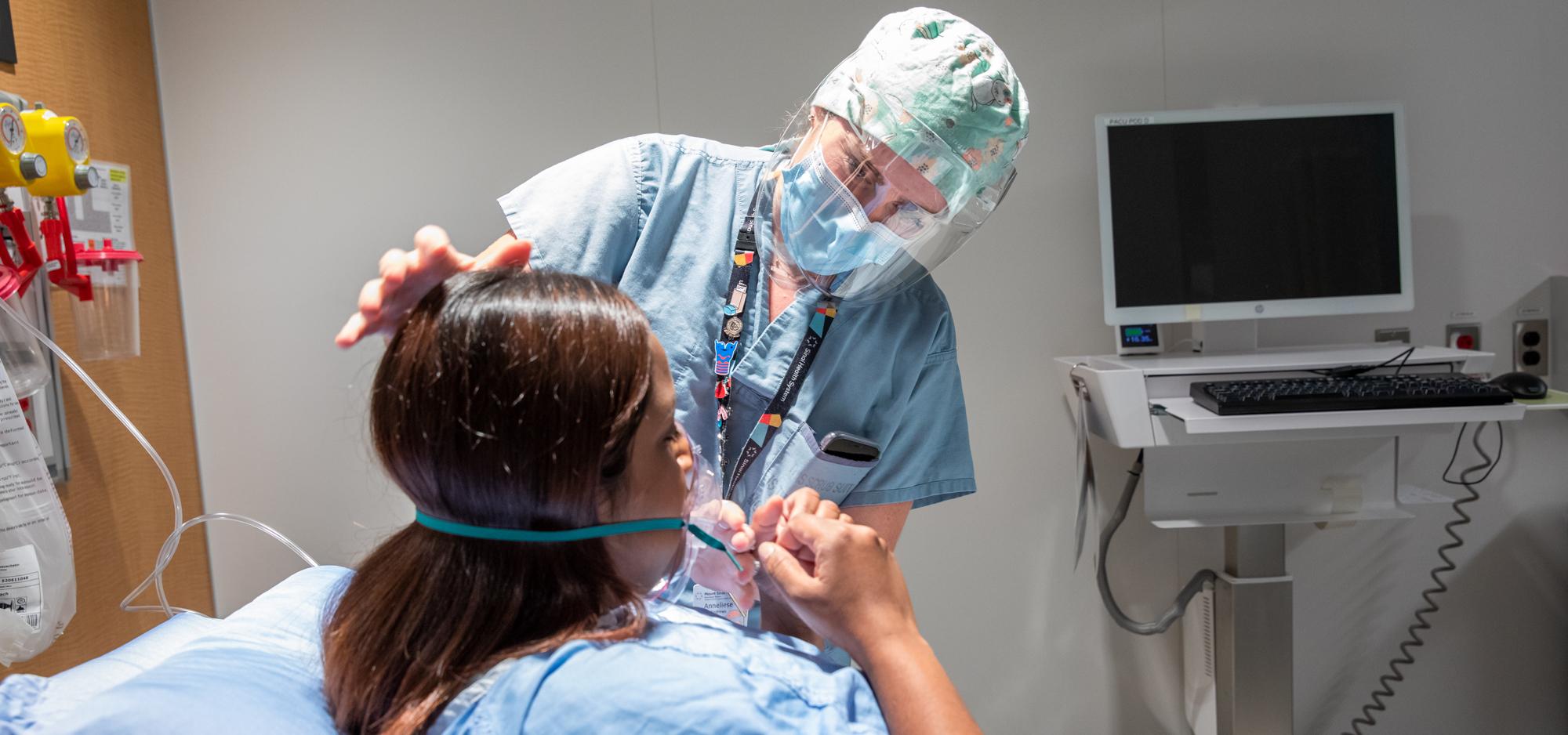 Respiratory Therapist demonstrates how to apply oxygen therapy with Registered Nurse