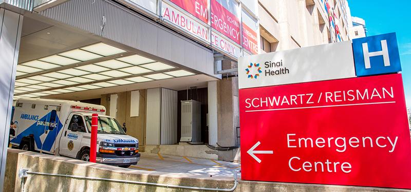 Entrance to Emergency Centre with ambulance vehicle in front