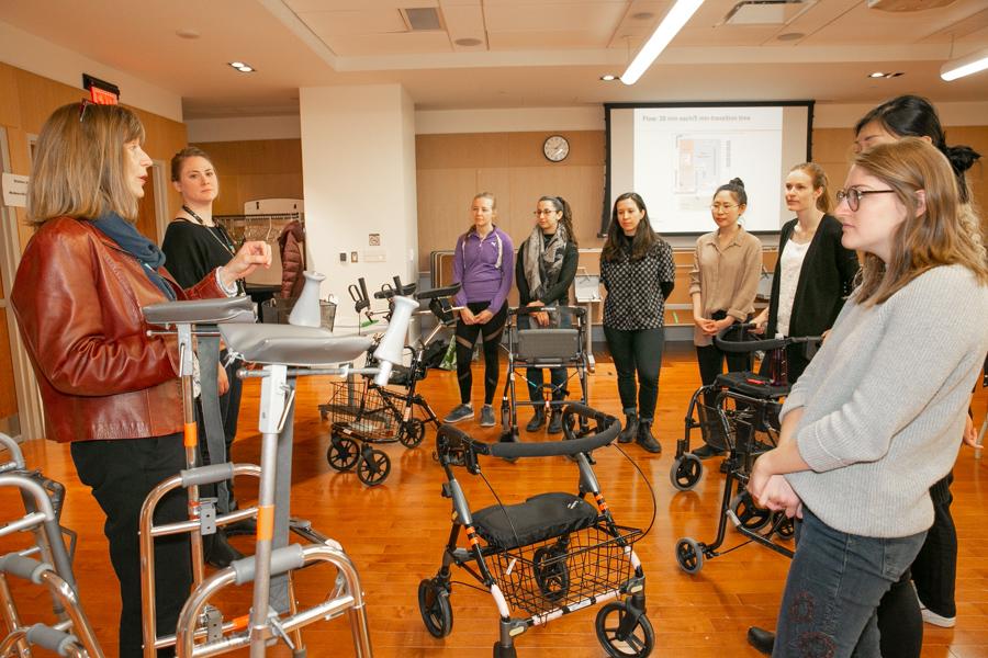 Occupational therapy students listening to instruction from an educator