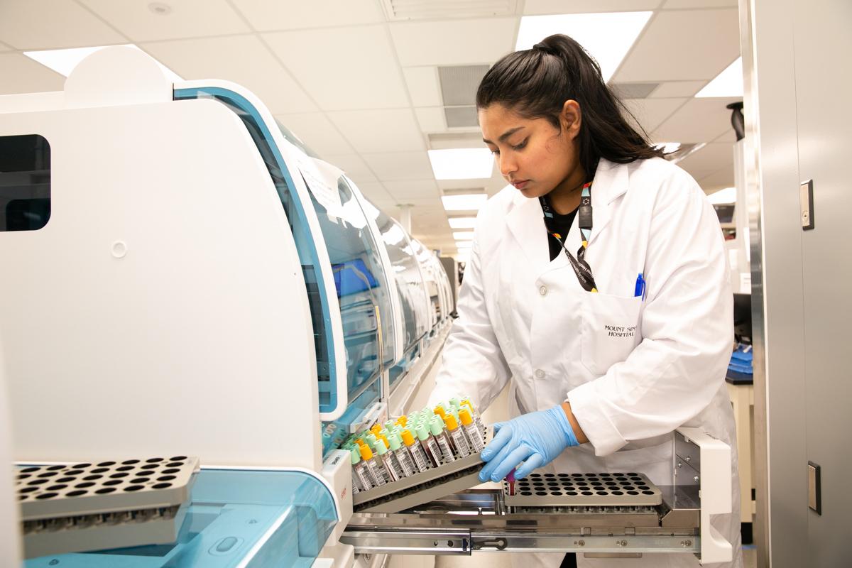 Mount Sinai Department of Pathology and Laboratory Medicine employee collecting patient samples.