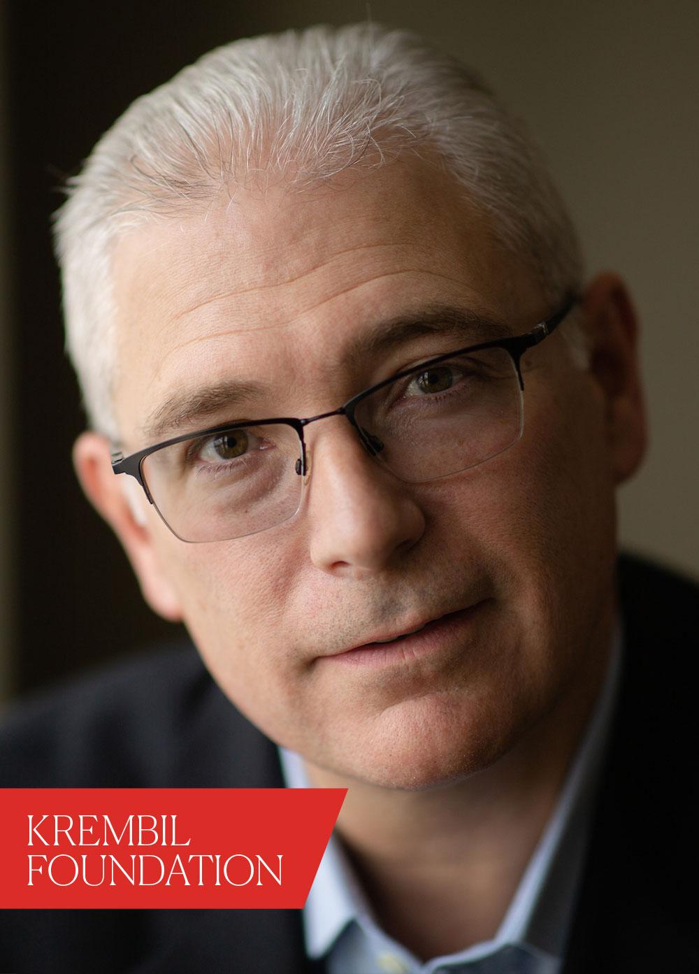 man wearing glasses. text in red box reads, "Krembil Foundation"