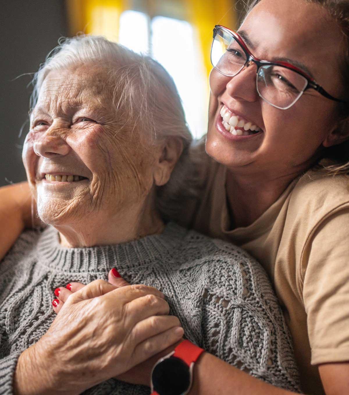 young woman sits behind older women