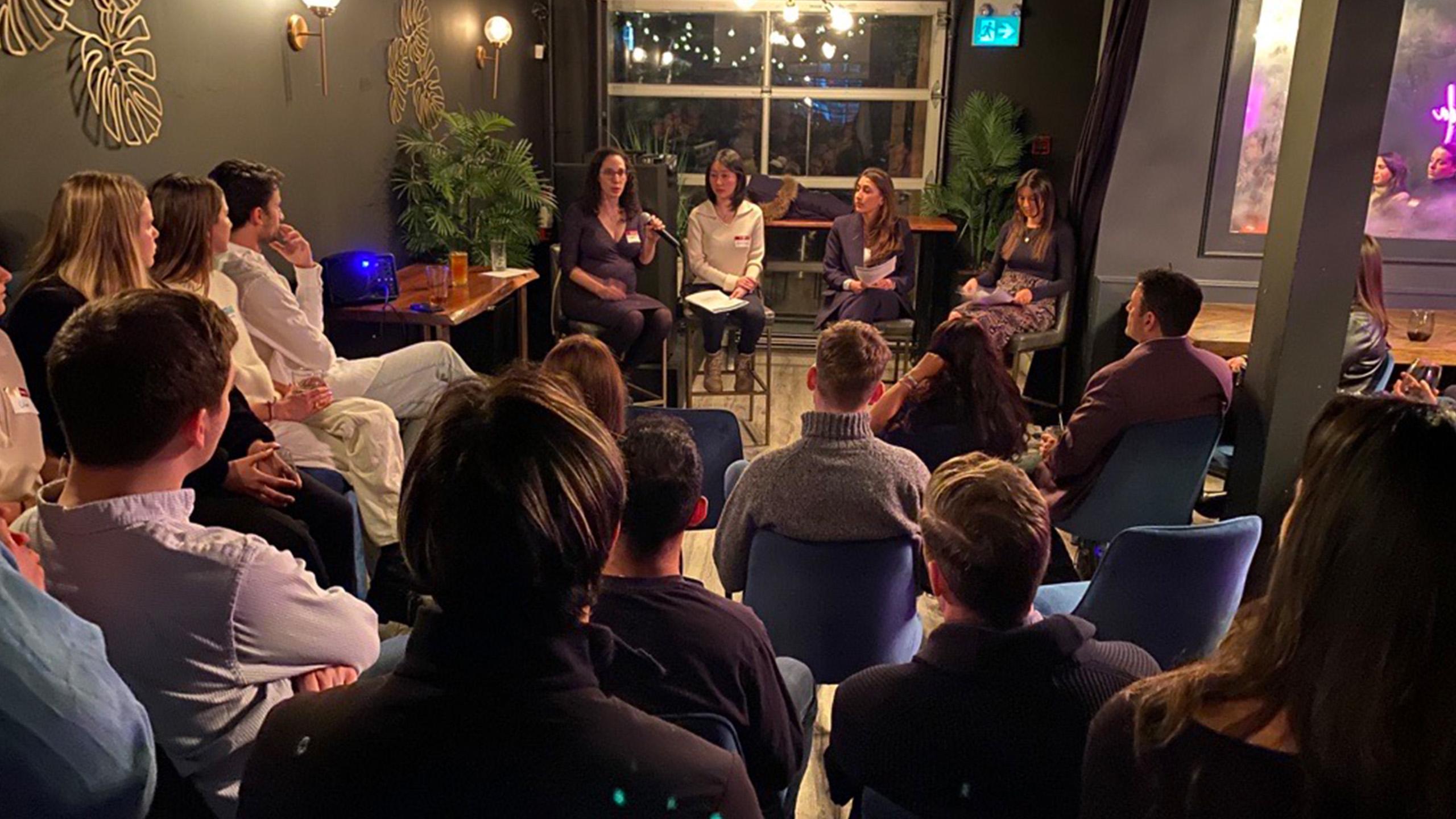 Audience watching a panel discussion