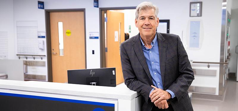 Dr. Bjug Borgundvaag in a blue dress shirt and blazer at the emergency department. 