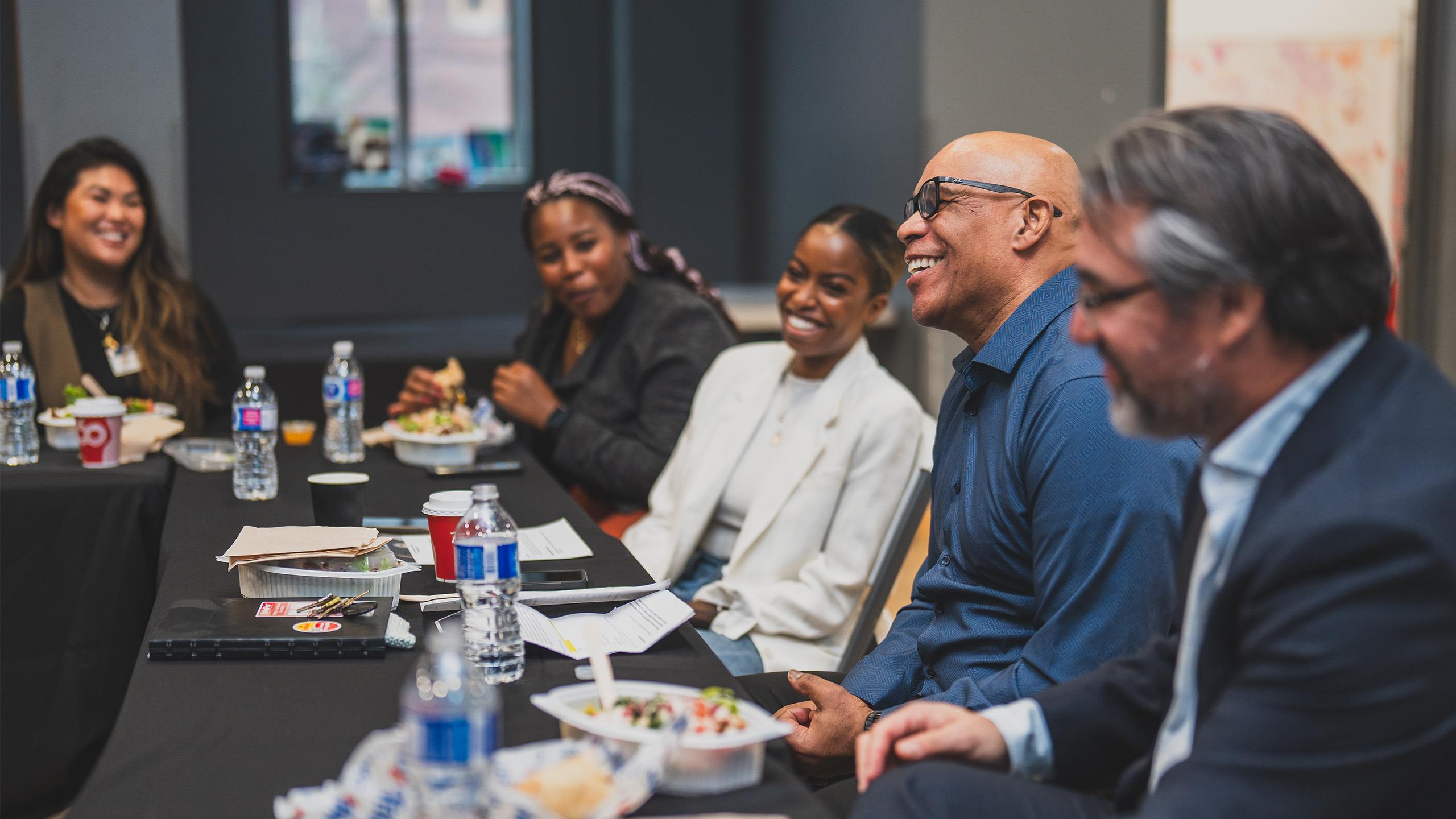 People sitting at a table laughing