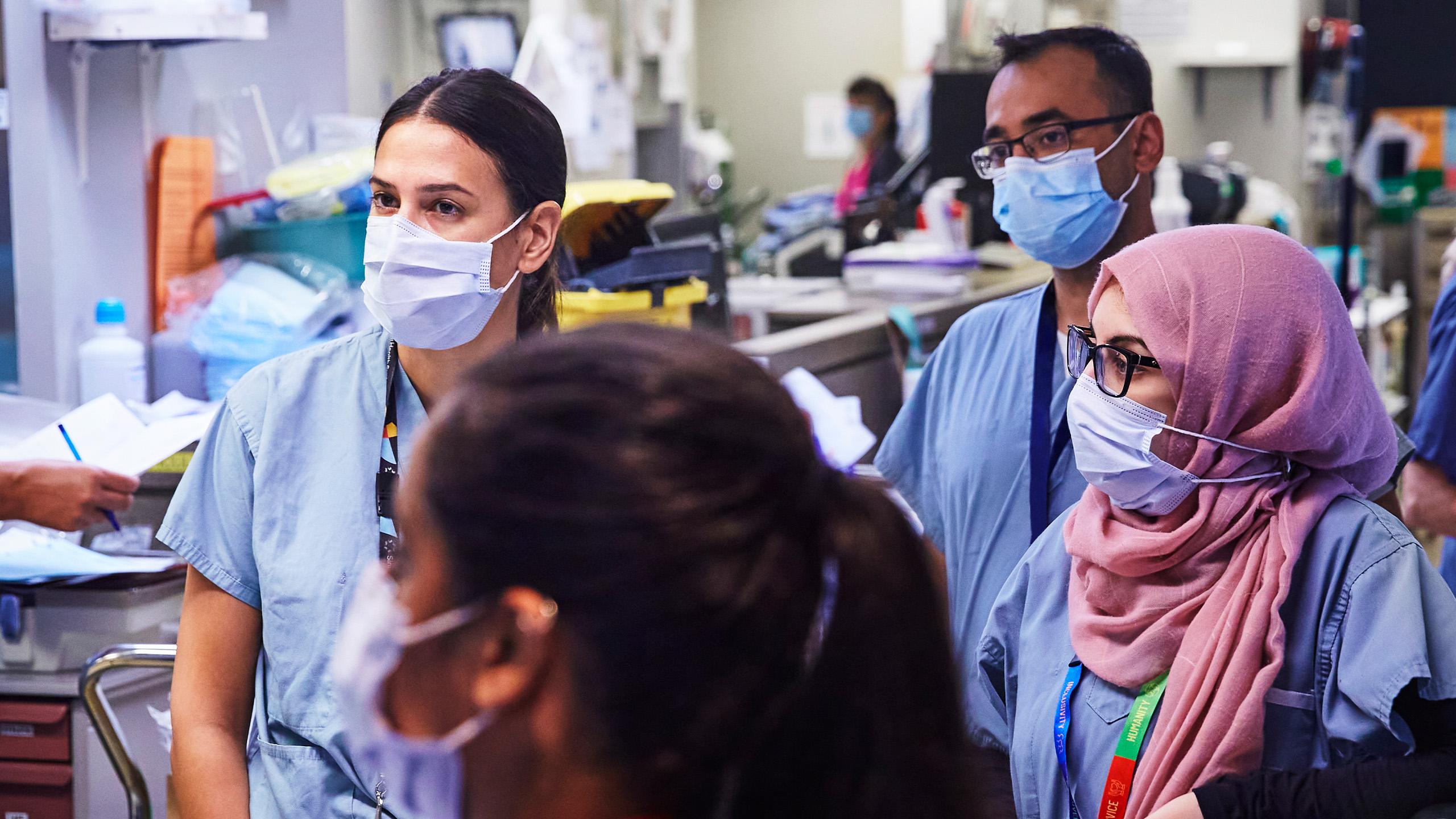 Medical professionals meeting in ICU