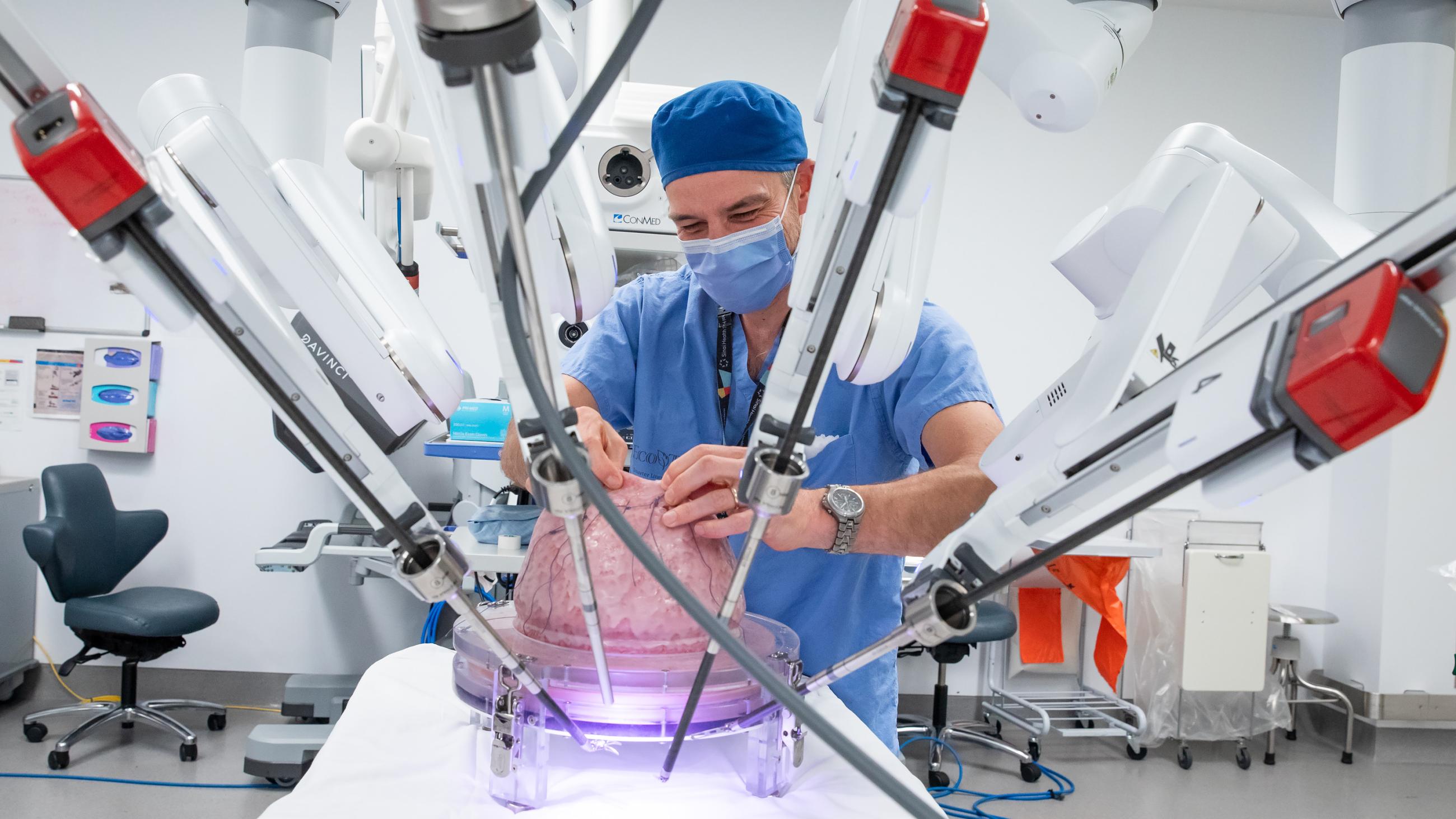 Surgeon in surgery room with robotics 