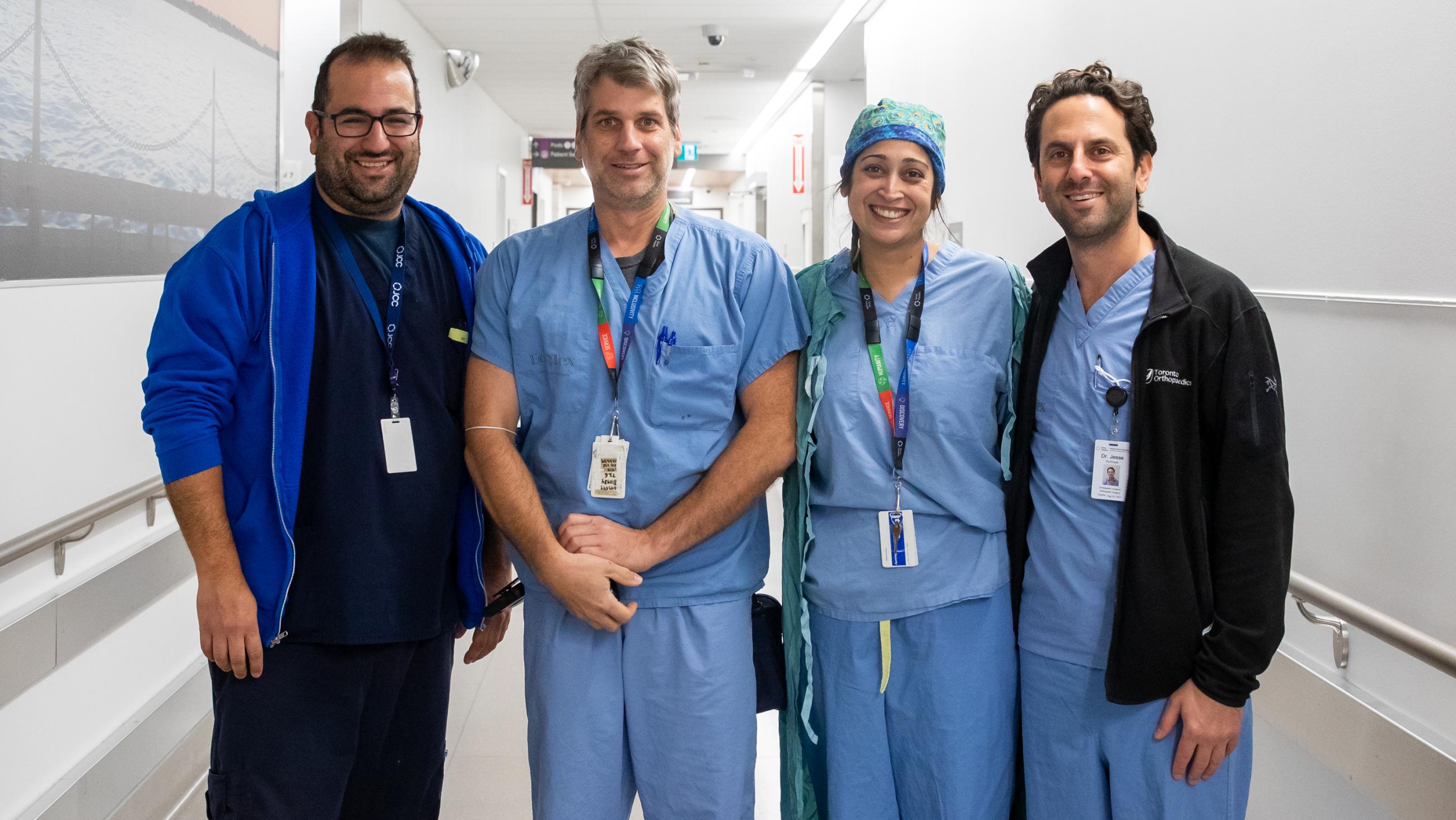 Physicians in blue scrubs in the operating room