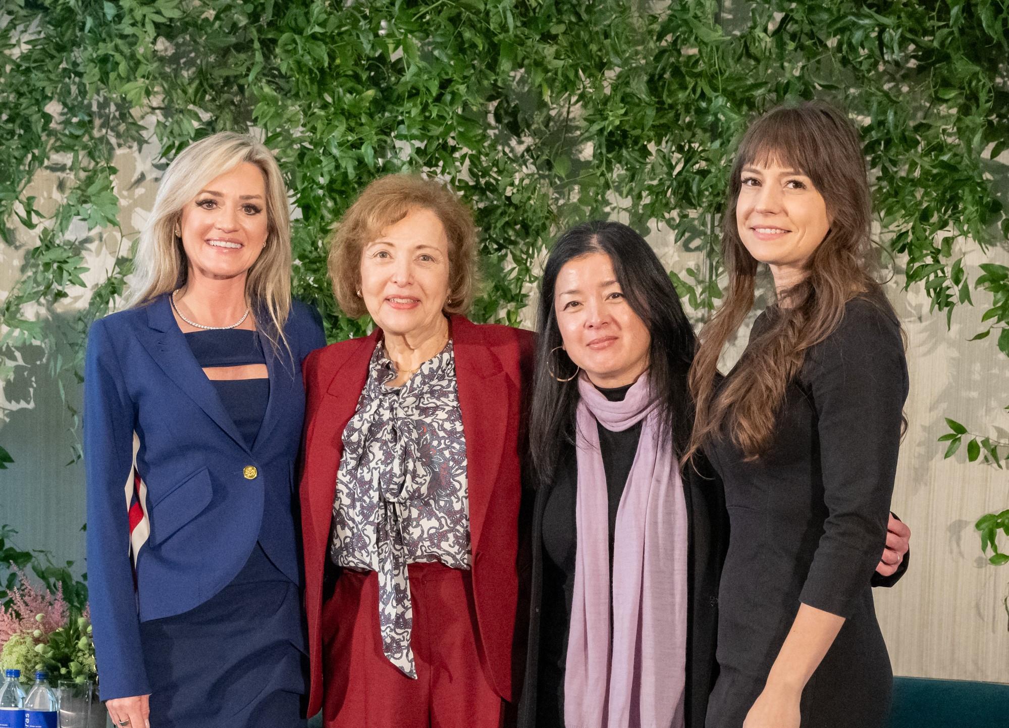 four women smiling