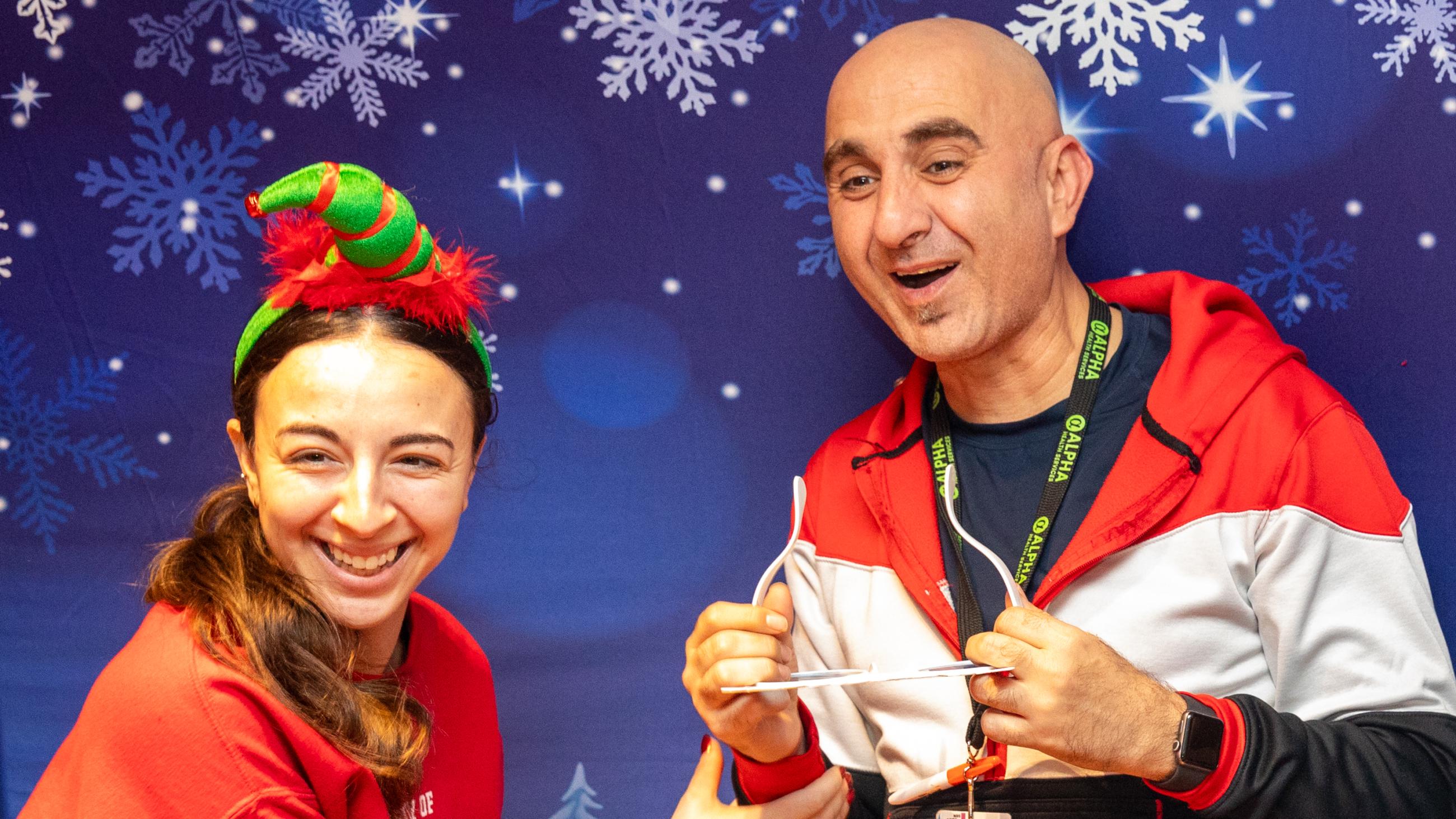 Staff members pose at the photo booth during Sinai Health’s Holiday Open House. 