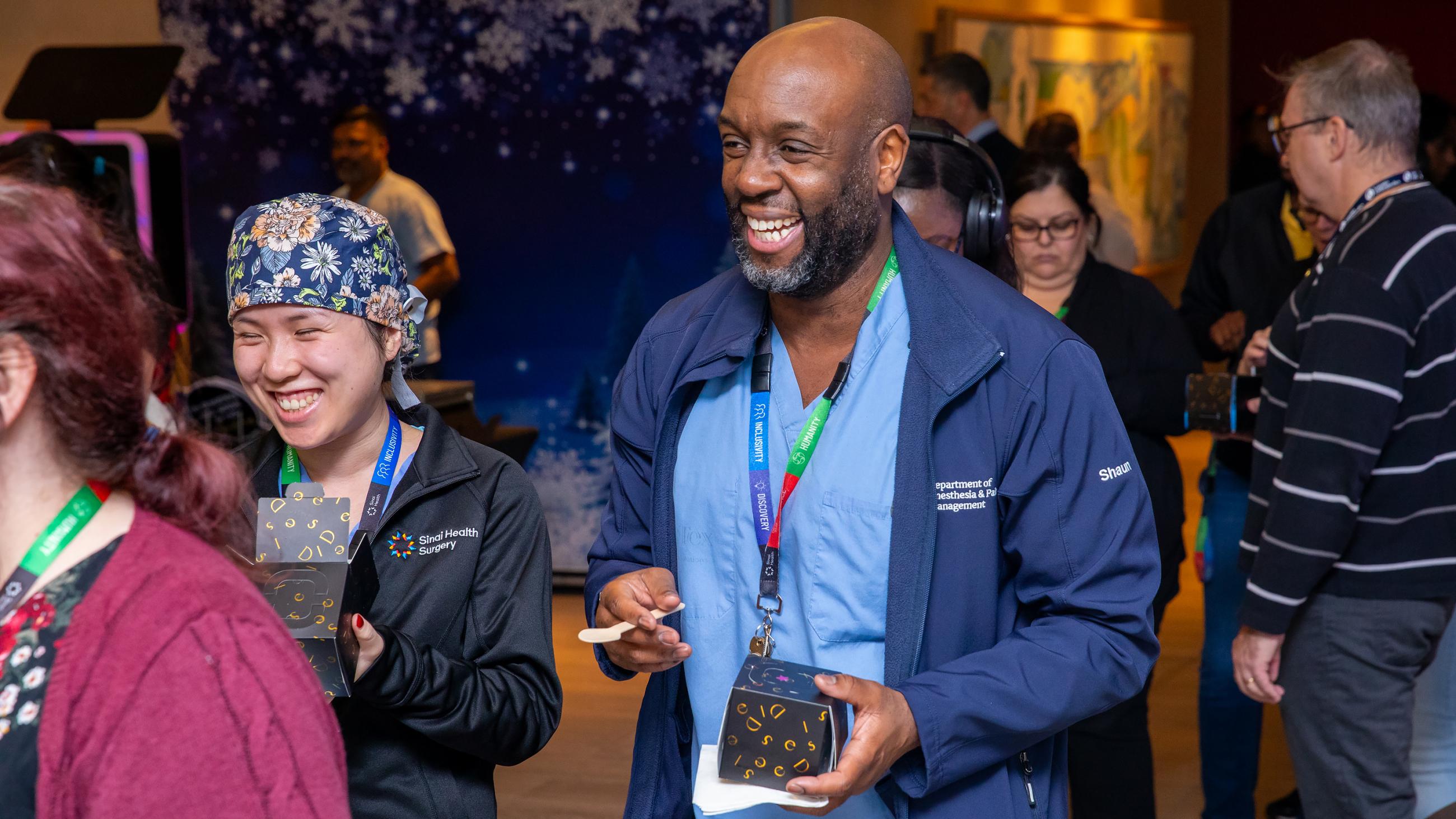 Sinai Health people celebrate together at the annual Holiday Open House.