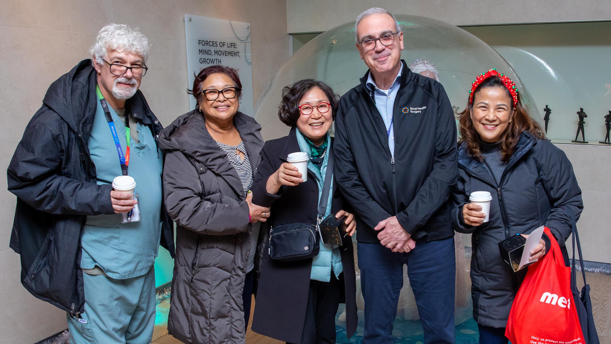 Sinai Health people celebrate together at the annual Holiday Open House.