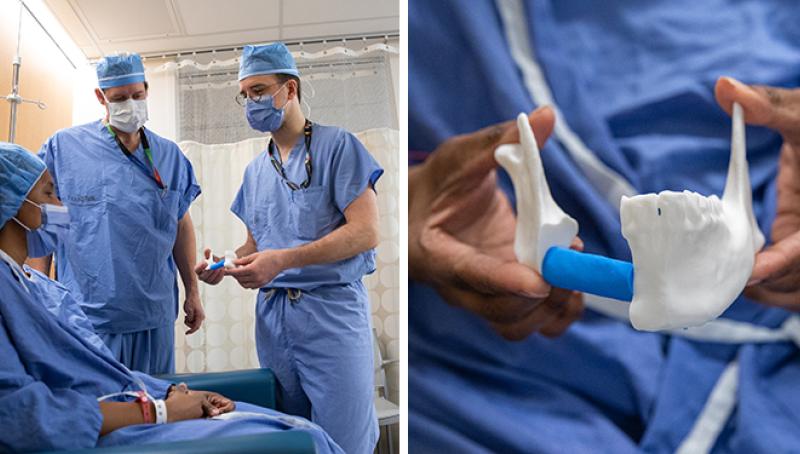 Photo of surgeons with patient who is all gowned up holding a 3D printed version of her jaw. 