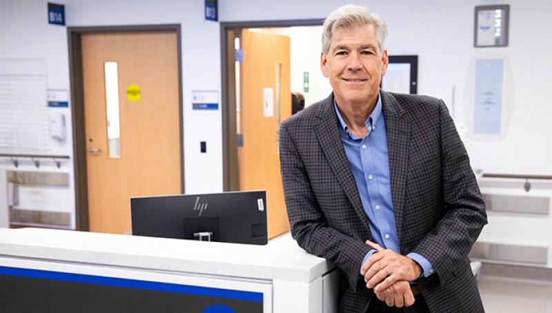 Dr. Bjug Borgundvaag in a blue dress shirt and blazer at the emergency department. 