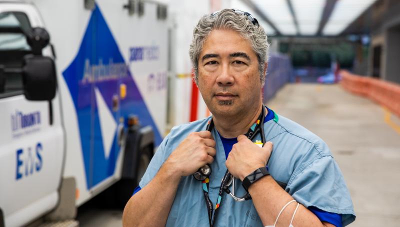 Dr. Jacques Lee standing in the ambulance driveway.