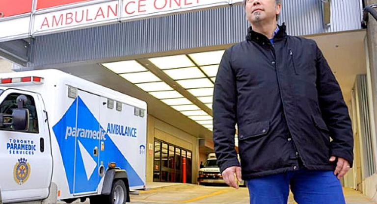 Dr. Jacques Lee standing in front of the emergency entrance