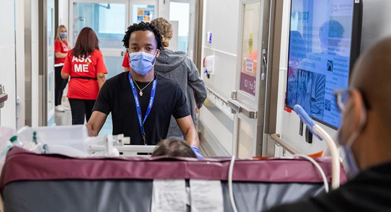 a patient being moved from an old ICU into the newly opened one