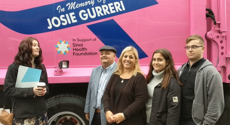 The Gurreri family in front of their pink truck.