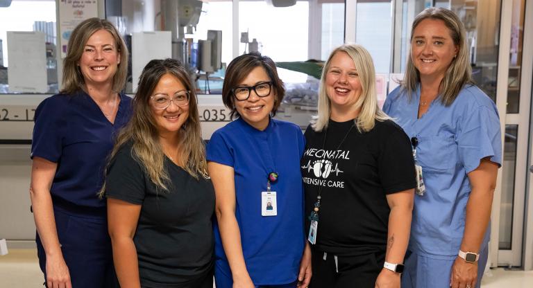 Five NICU nurses posing for group shot