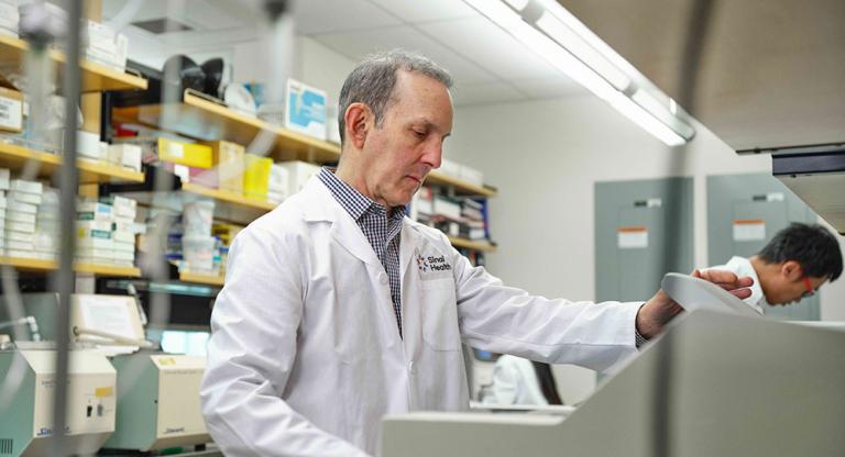 man stands in medical laboratory