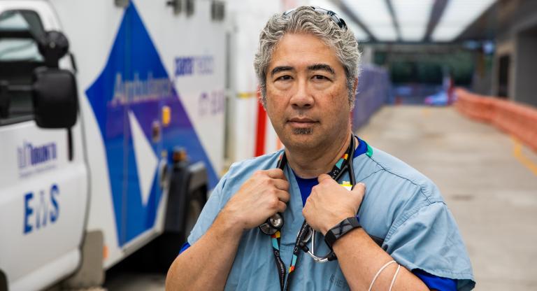 Dr. Jacques Lee standing in the ambulance driveway.