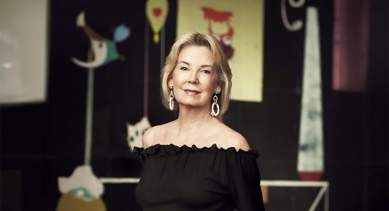 Photo of Hilary Weston wearing a black shirt in front of art sculptures