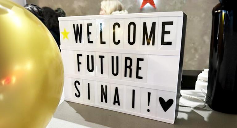 Sign that reads welcome future sinai