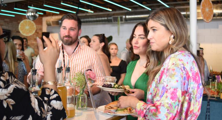 Group of people talking at a social event