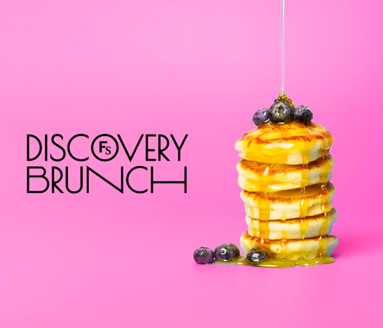 Logo that says discovery brunch next to a stack of pancakes on a bright pink background